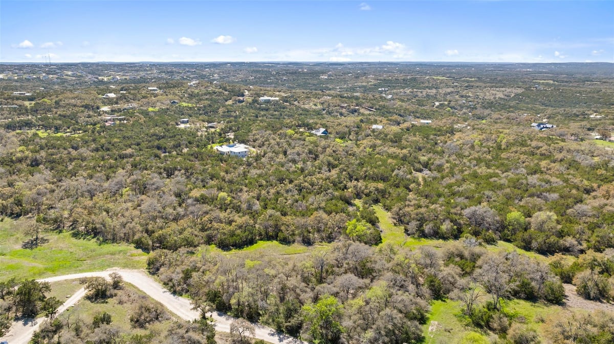 View 13005 D Fitzhugh Rd in Jester King Ranch 13005 D Fitzhugh Rd - front exterior - Luxury lot in Jester King Ranch, Austin, TX