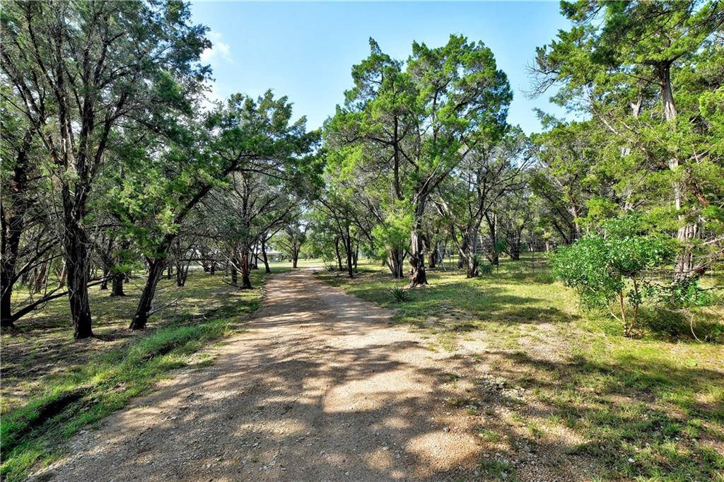 View 13012 S Madrone Trl in BEAR CREEK OAKS 13012 S Madrone Trl - front exterior - Luxury home in BEAR CREEK OAKS, Austin, TX