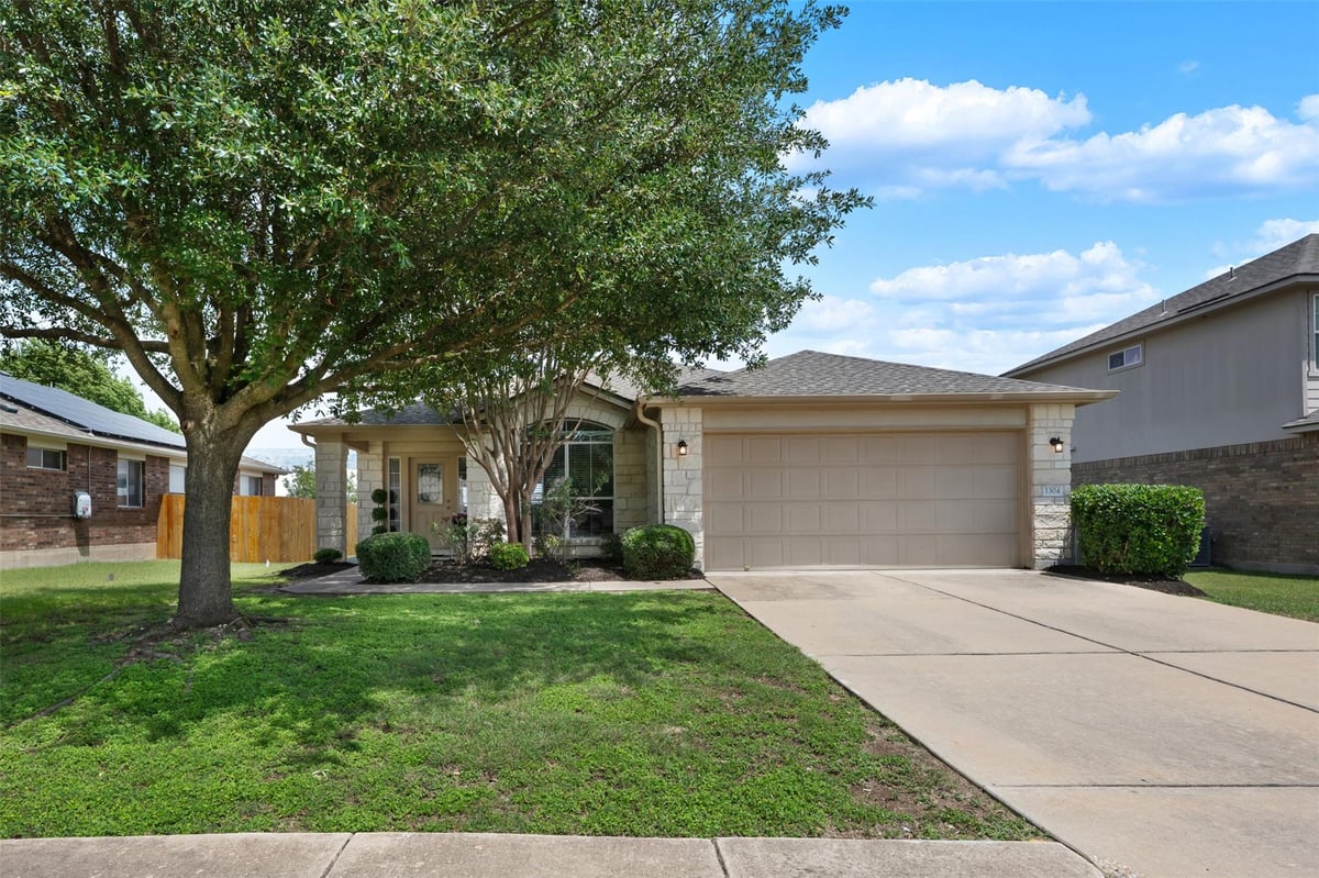 View 1304 Hensley DR in Benbrook Ranch Sec 02 Ph 01 1304 Hensley DR - front exterior - Luxury home in Benbrook Ranch Sec 02 Ph 01, Leander, TX