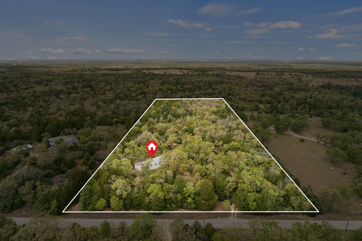 View 1319 County Road C in Blue Properties Sec C 1319 County Road C - front exterior - Luxury home in Blue Properties Sec C, Lexington, TX