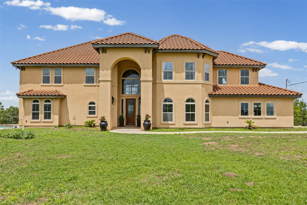 View 134 River Forest DR in Pine Forest Unit 8 Ph Iii 134 River Forest DR - front exterior - Luxury home in Pine Forest Unit 8 Ph Iii, Bastrop, TX