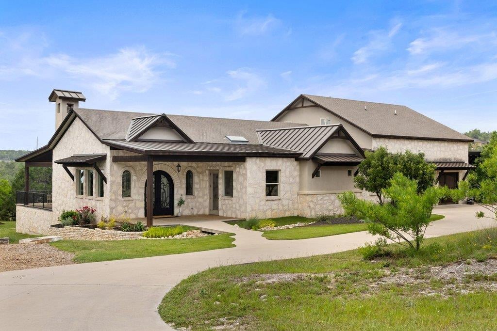 View 13442 Saddle Back Pass in Homestead Sec 02 13442 Saddle Back Pass - front exterior with Hill Country luxury facade - Luxury home in Homestead Sec 02, Austin, TX