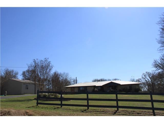 View 137 Black Jack LN 137 Black Jack LN - front exterior - Luxury home in Bastrop, TX