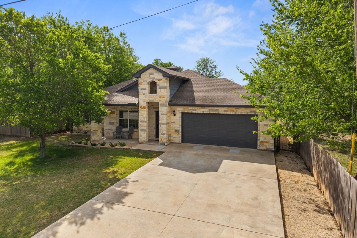 View 139 Waikakaaua Dr in Tahitian Village 139 Waikakaaua Dr - front exterior - Luxury home in Tahitian Village, Bastrop, TX