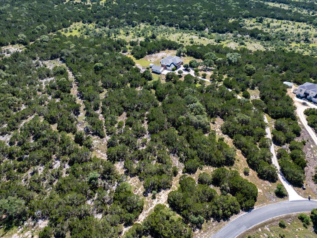 View 140 Cave Springs Rd in LOST SPRINGS 140 Cave Springs Rd - front exterior - Luxury lot in LOST SPRINGS, Wimberley, TX