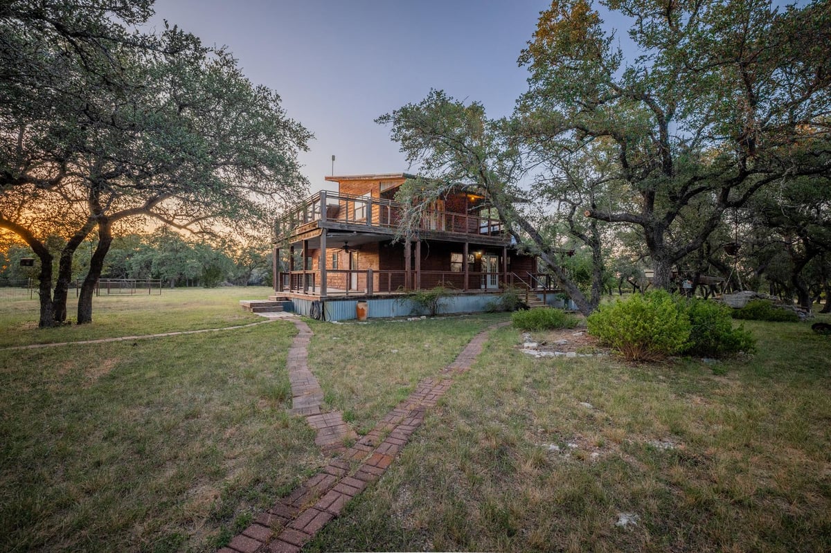 View 140 Mountain Loop DR in Flat Creek Ranches 140 Mountain Loop DR - property photo 1 - Luxury home in Flat Creek Ranches, Johnson City, TX