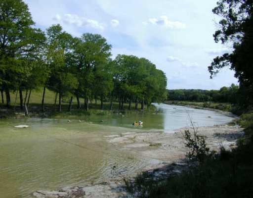 View 140 Water Park RD 140 Water Park RD - front exterior - Luxury home in Wimberley, TX