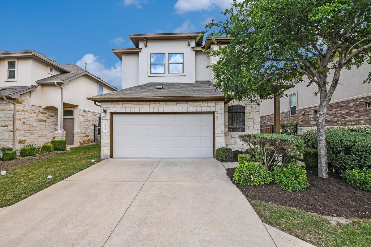View 1401 Little Elm TRL Unit #205 in Woodford Condos 1401 Little Elm TRL Unit #205 - front exterior - Luxury home in Woodford Condos, Cedar Park, TX