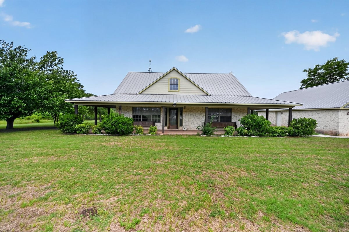 View 1410 County Road 258 in DAVID HARMON 1410 County Road 258 - front exterior - Luxury home in DAVID HARMON, Bertram, TX