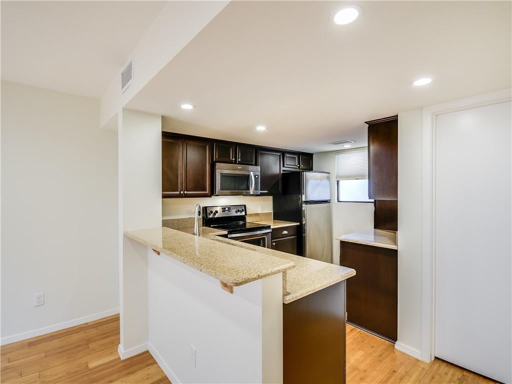 View 1411 Norwalk LN Unit #211 in Norwalk Square Condo 1411 Norwalk LN Unit #211 - property photo 1 - Luxury home in Norwalk Square Condo, Austin, TX