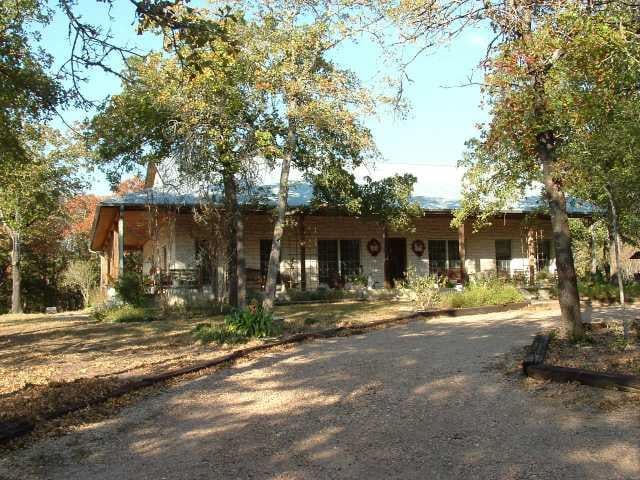 View 142 Northside LN 142 Northside LN - front exterior - Luxury home in Cedar Creek, TX
