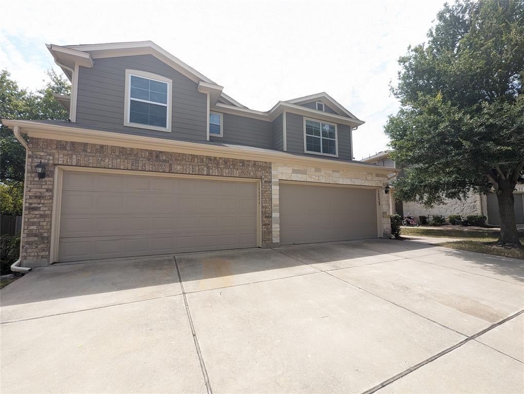View 14404 Charles Dickens Dr Unit #A in Parkside At Northtown Condomin 14404 Charles Dickens Dr Unit #A - front exterior - Luxury home in Parkside At Northtown Condomin, Pflugerville, TX