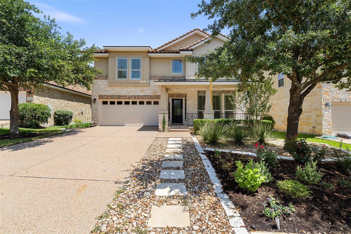 View 14408 Broadwinged Hawk Dr in Falconhead / Spillman Ranch Ph 01 Sec 06 14408 Broadwinged Hawk Dr - front exterior - Luxury home in Falconhead / Spillman Ranch Ph 01 Sec 06, Austin, TX