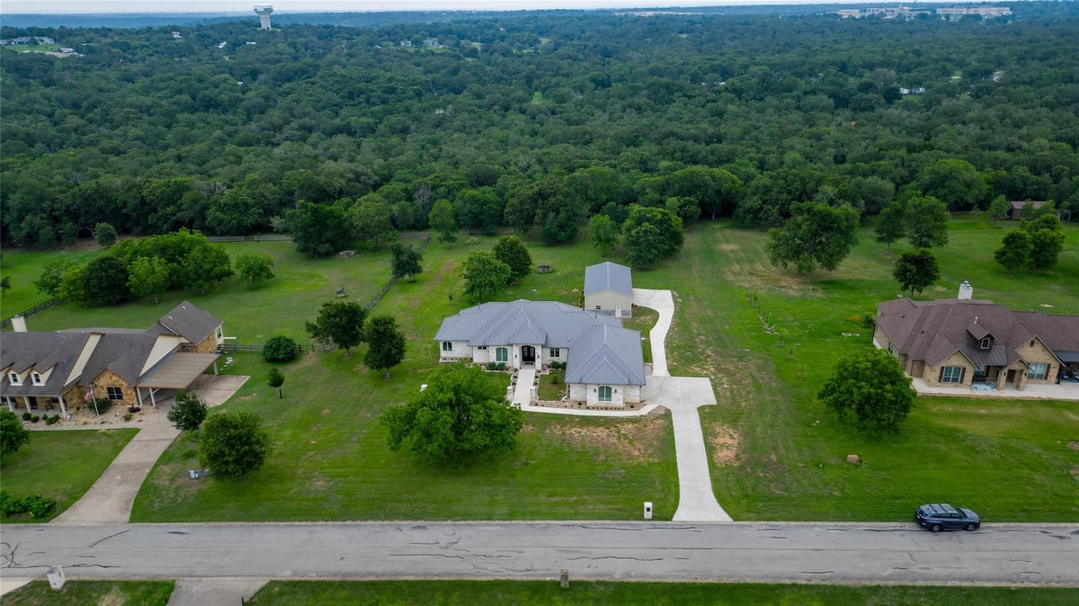 View 145 Pavilion DR in The Forest At Colorado Crossin 145 Pavilion DR - front exterior - Luxury home in The Forest At Colorado Crossin, Cedar Creek, TX