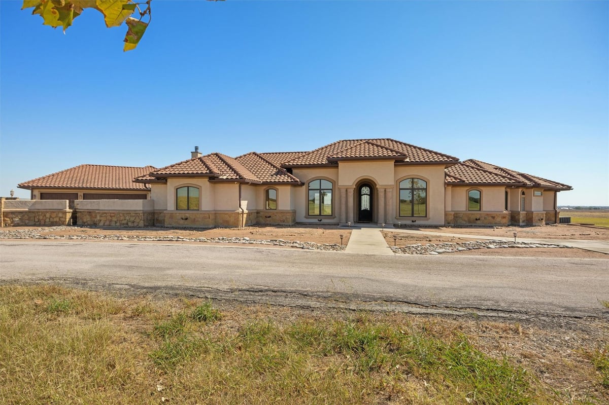 View 14502 Lund Carlson Rd in N/A 14502 Lund Carlson Rd - front exterior with 14502 Lund Carlson Rd in Coupland - Luxury home in N/A, Coupland, TX