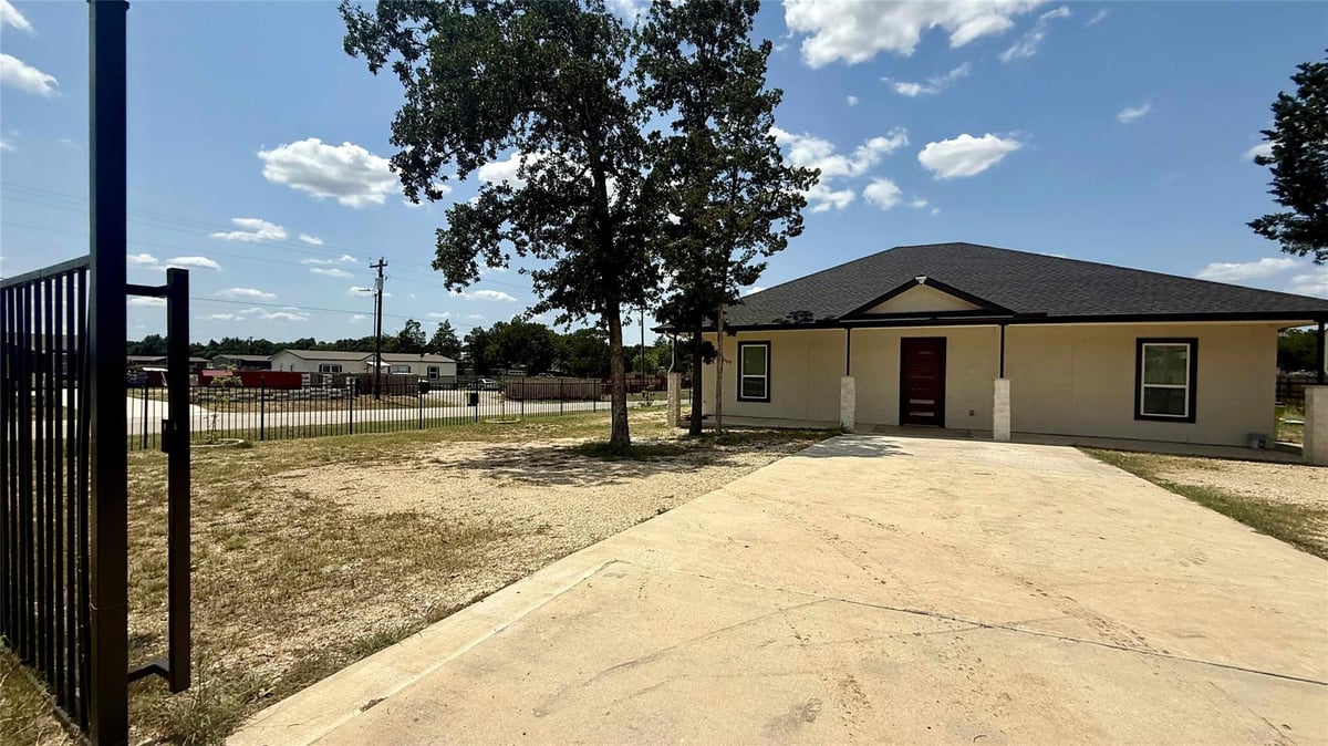 View 146 Buena Fortuna Rd in LOS SENDEROS 146 Buena Fortuna Rd - front exterior - Luxury home in LOS SENDEROS, Elgin, TX