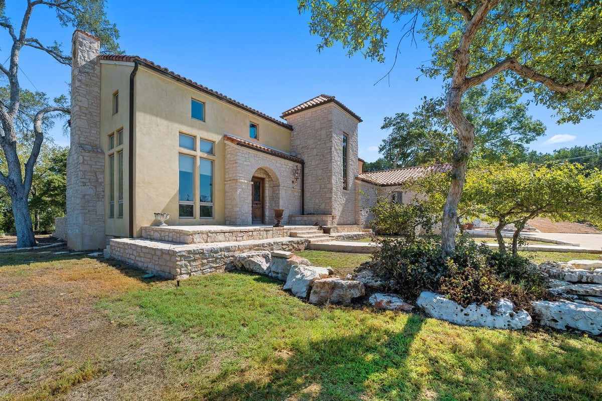 View 14721 Bear Creek Pass in Bear Creek Estates I 14721 Bear Creek Pass - front exterior with modern vertical facade - Luxury home in Bear Creek Estates I, Austin, TX