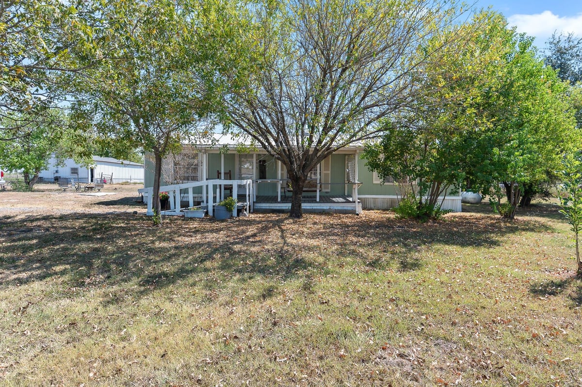 View 14815 Johnson Road TRL in GREENBURY GATES SURV #63 ABS # 14815 Johnson Road TRL - front exterior - Luxury home in GREENBURY GATES SURV #63 ABS #, Manor, TX