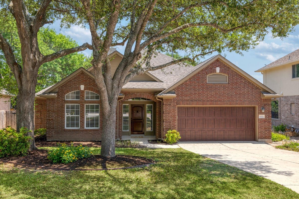 View 14943 Doria Dr in Lake At Wells Branch Sec 02 14943 Doria Dr - front exterior - Luxury home in Lake At Wells Branch Sec 02, Austin, TX