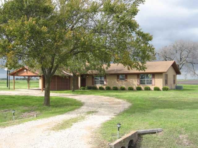 View 150 County Road 338 150 County Road 338 - front exterior - Luxury home in Granger, TX
