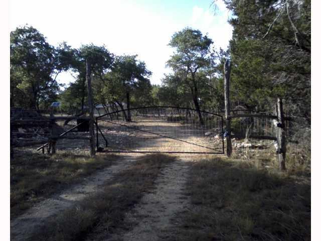 View 1510 Sandy Point RD 1510 Sandy Point RD - front exterior - Luxury home in Wimberley, TX
