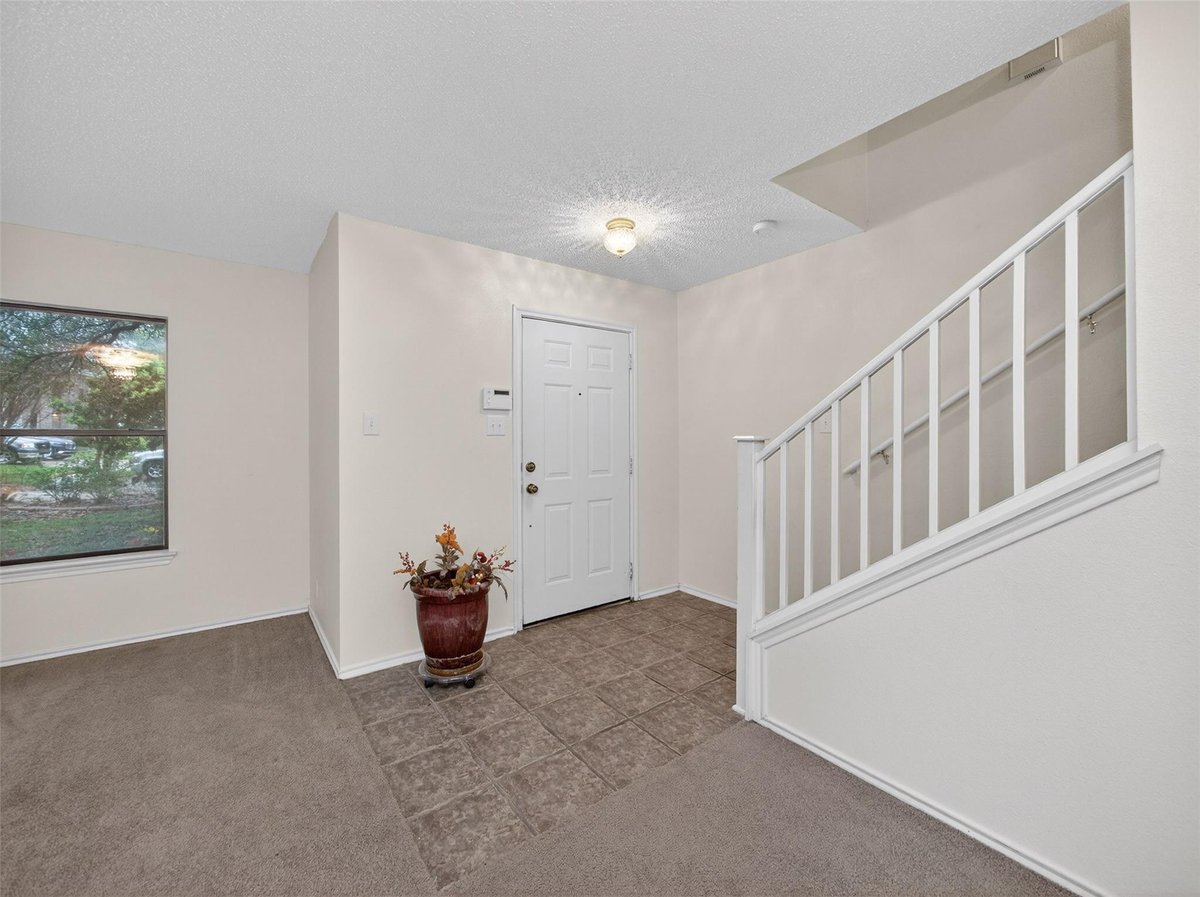 Living area at 15300 Iola Cv - 4 bed 2 bath home