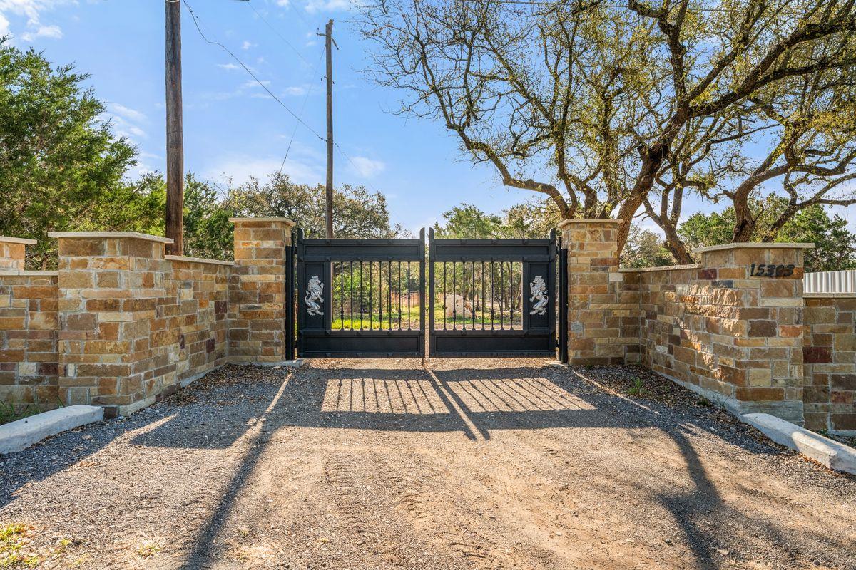 View 15303 Faubion TRL in Roundmountain Oaks Revision Of 15303 Faubion TRL - front exterior - Luxury home in Roundmountain Oaks Revision Of, Leander, TX
