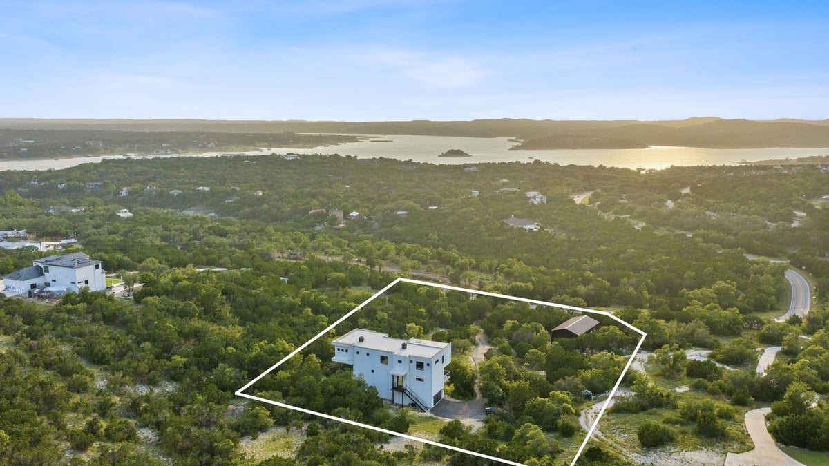 View 15424 FM 2769 Rd in Ferguson Estates 15424 FM 2769 Rd - front exterior - Luxury home in Ferguson Estates, Volente, TX