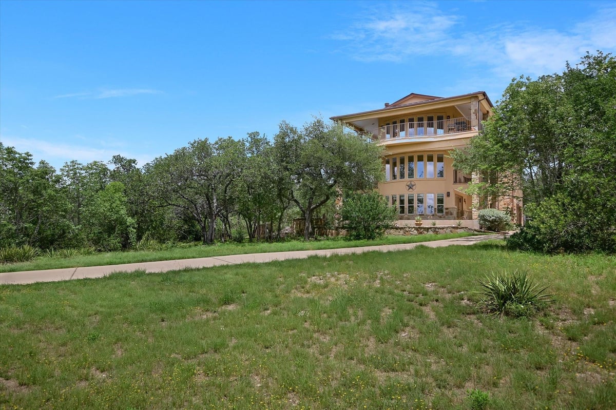 View 15936 Booth CIR in Rd Barrick Sub 15936 Booth CIR - front exterior - Luxury home in Rd Barrick Sub, Volente, TX