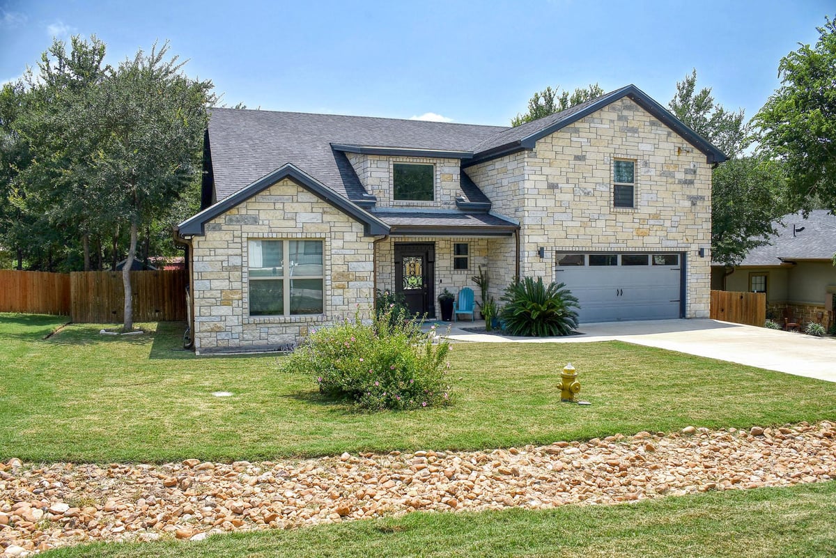 View 160 Nuuanu LN in Tahitian Village, 160 Nuuanu LN - front exterior - Luxury home in Tahitian Village,, Bastrop, TX