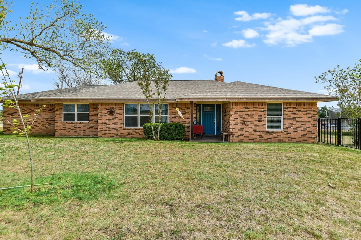 View 1601 CR 463 (and CR 465) in T7053501-SCO-Coupland 1601 CR 463 (and CR 465) - front exterior - Luxury home in T7053501-SCO-Coupland, Elgin, TX