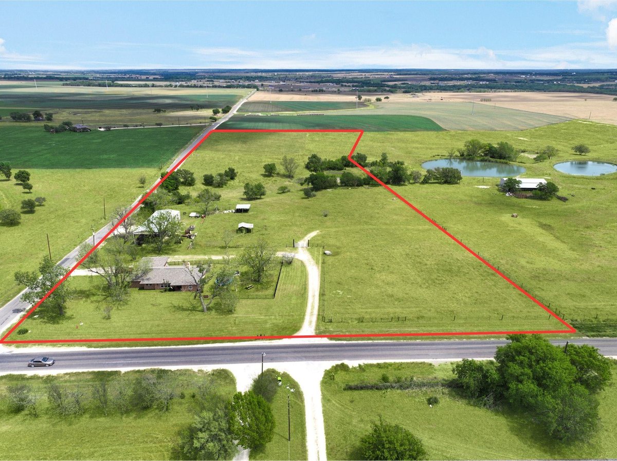 View 1601 CR 463 (and CR 465) in T7053501-SCO-Coupland 1601 CR 463 (and CR 465) - front exterior - Luxury home in T7053501-SCO-Coupland, Elgin, TX