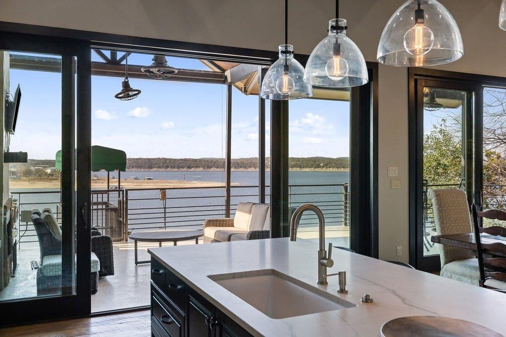 View 1606 Buffalo Gap RD in Buffalo Gap 1606 Buffalo Gap RD - patio with covered lakefront terrace - Luxury home in Buffalo Gap, Austin, TX
