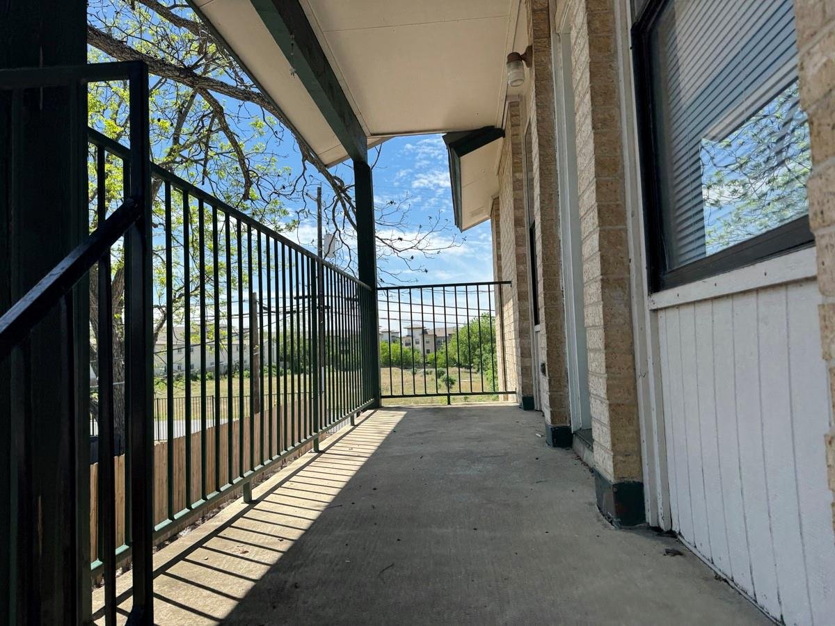 Primary bedroom at 1624 Aquarena Springs Dr Unit #A102 - 2 bed 2 bath home