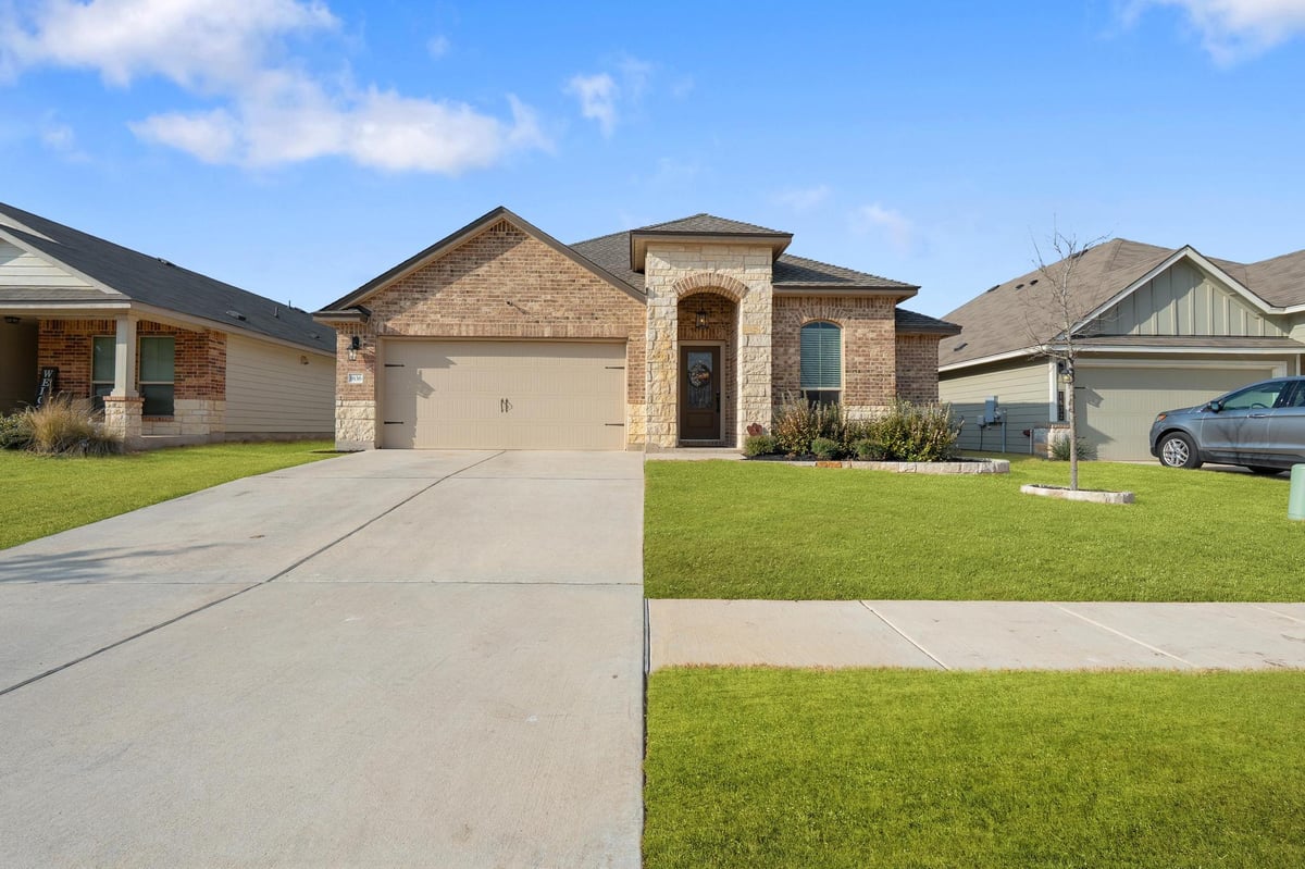 View 1636 T H Johnson Dr in GROVE AT BULL CREEK 1636 T H Johnson Dr - property photo 1 - Luxury home in GROVE AT BULL CREEK, Taylor, TX
