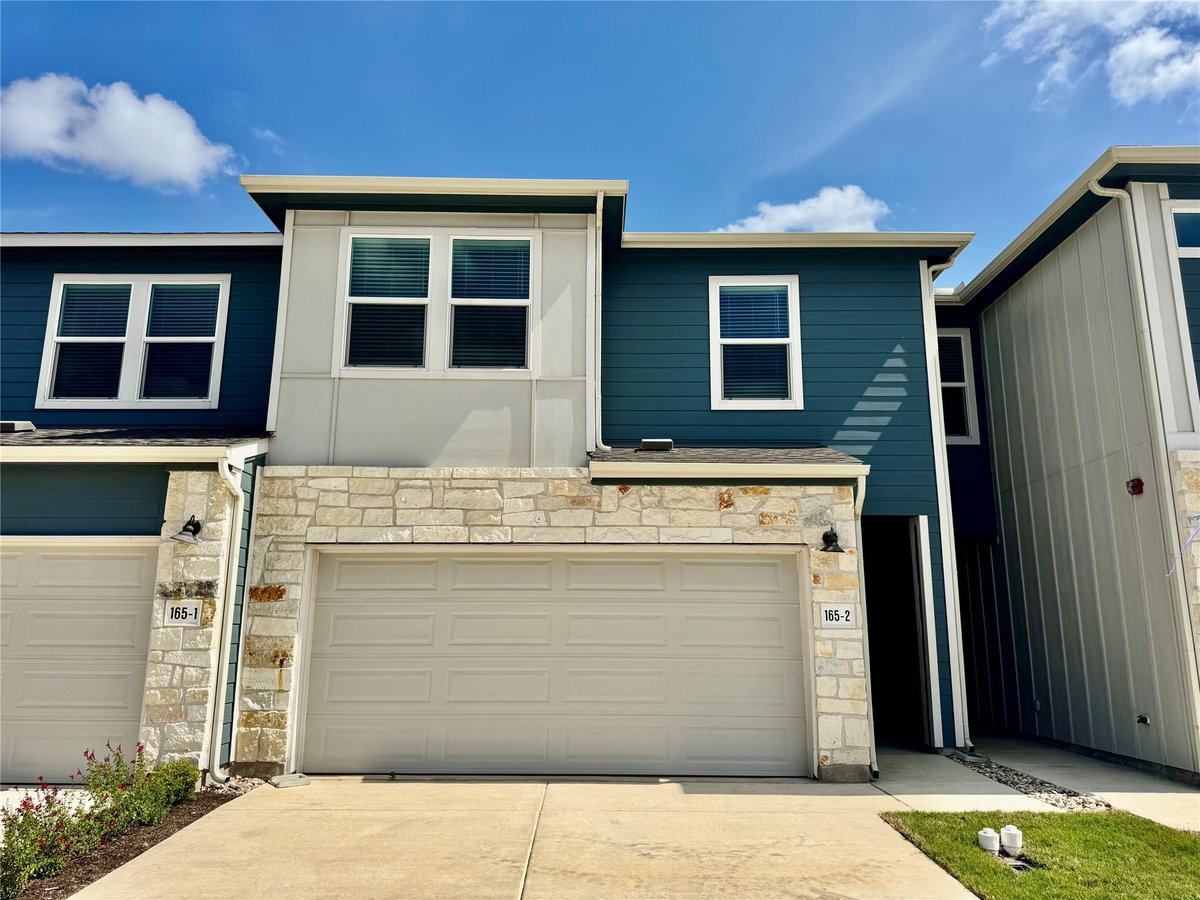 View 165 Calcite Rd Unit #2 in Waterstone Village 165 Calcite Rd Unit #2 - front exterior - Luxury home in Waterstone Village, Kyle, TX