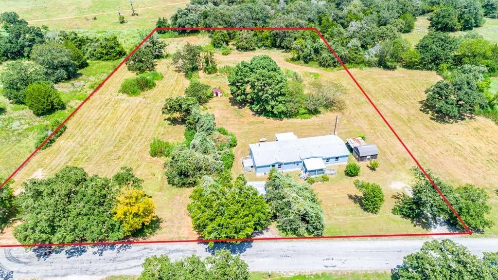 View 166 Rosanky Cattle Company RD in Clelland, John J 166 Rosanky Cattle Company RD - property photo 1 - Luxury home in Clelland, John J, Smithville, TX
