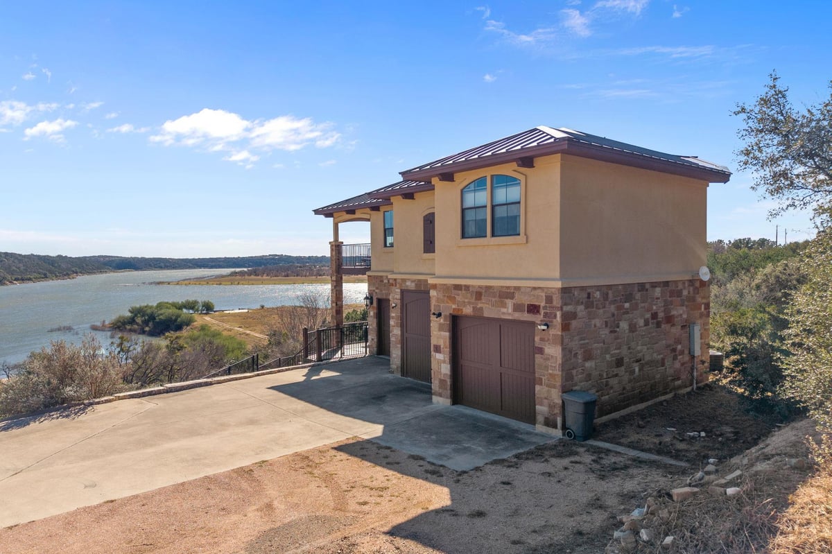 View 1690 Hickory Creek RD in John Wheaton 1690 Hickory Creek RD - front exterior - Luxury home in John Wheaton, Marble Falls, TX