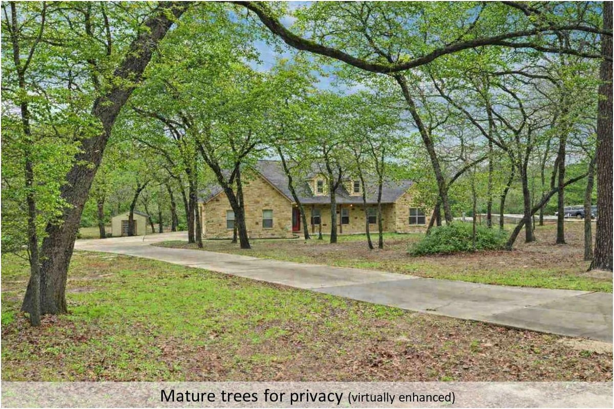 View 170 Woodland Ct in Pine Forest Unit 8 Ph Iii 170 Woodland Ct - front exterior - Luxury home in Pine Forest Unit 8 Ph Iii, Bastrop, TX