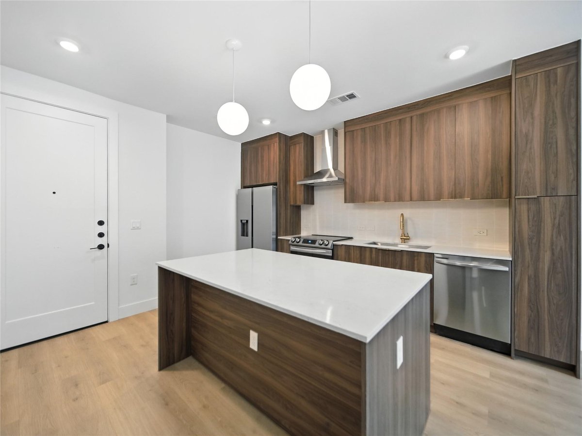 View 1701 Simond Ave Unit #302 in Parkside/Mueller Condos 1701 Simond Ave Unit #302 - front exterior - Luxury home in Parkside/Mueller Condos, Austin, TX