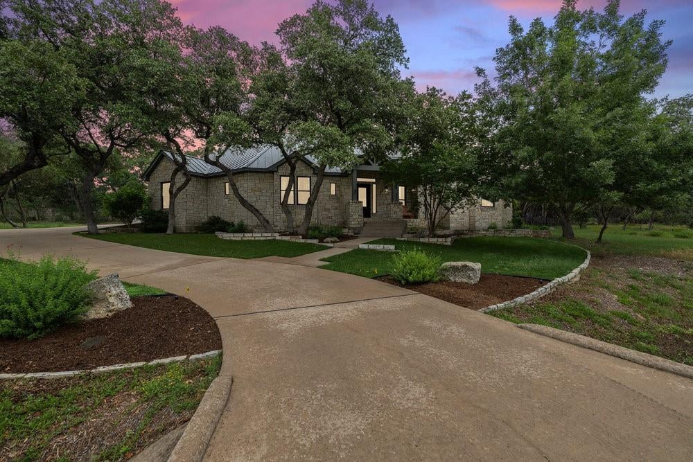View 17017 Trail Of The Woods in Woods Lake Travis Sec 02 17017 Trail Of The Woods - front exterior - Luxury home in Woods Lake Travis Sec 02, Austin, TX