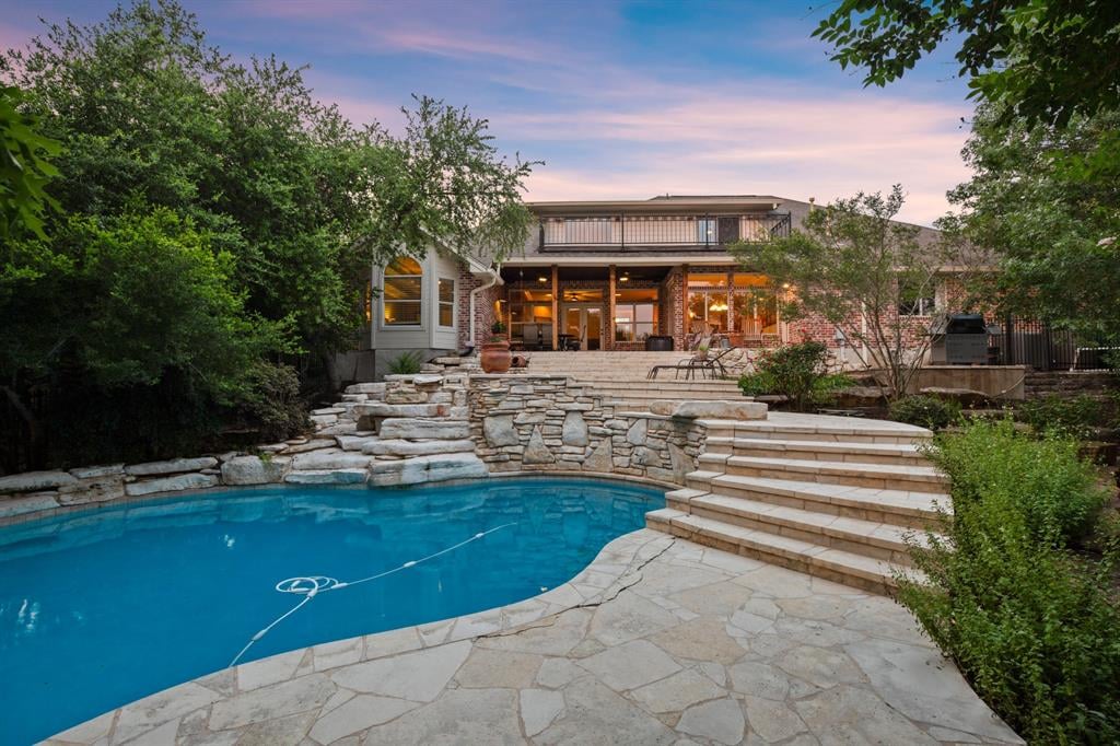 View 17030 Trail Of The Woods in Woods Lake Travis Sec 02 17030 Trail Of The Woods - front exterior - Luxury home in Woods Lake Travis Sec 02, Austin, TX