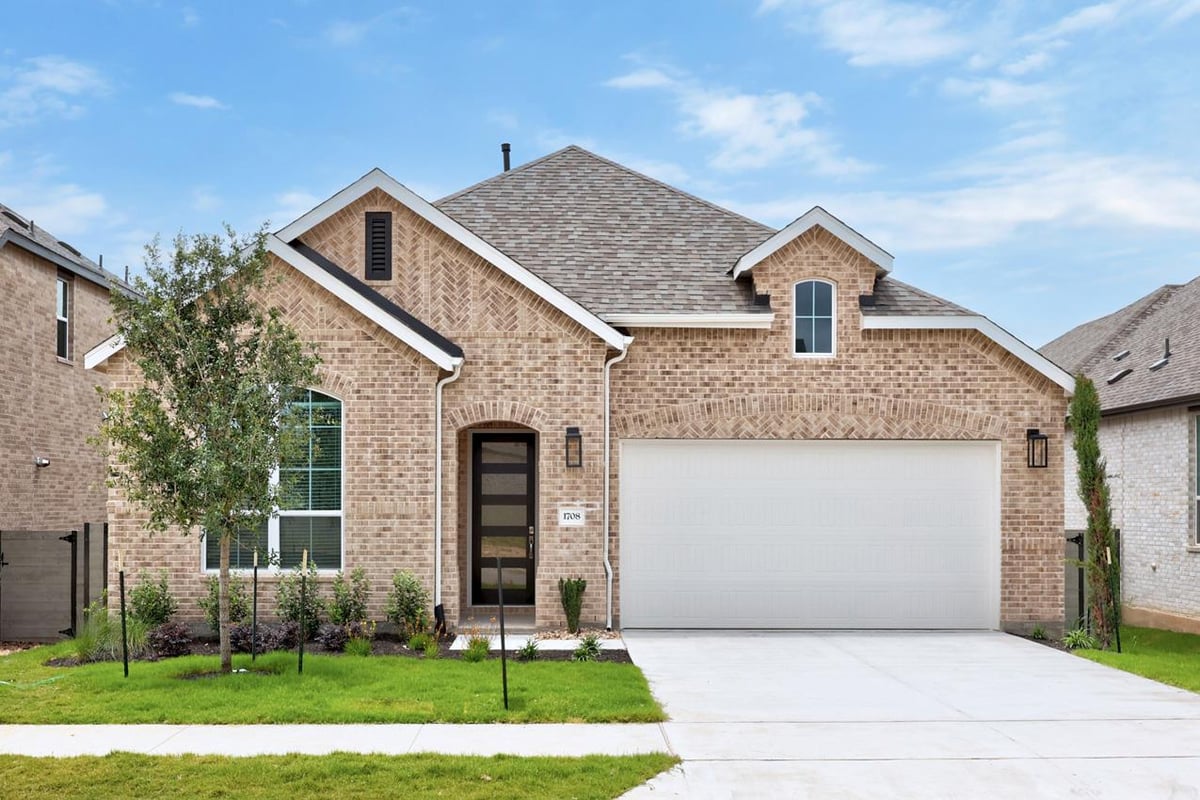 View 1708 Crimson Sunset DR in Wolf Ranch 1708 Crimson Sunset DR - front exterior - Luxury home in Wolf Ranch, Georgetown, TX