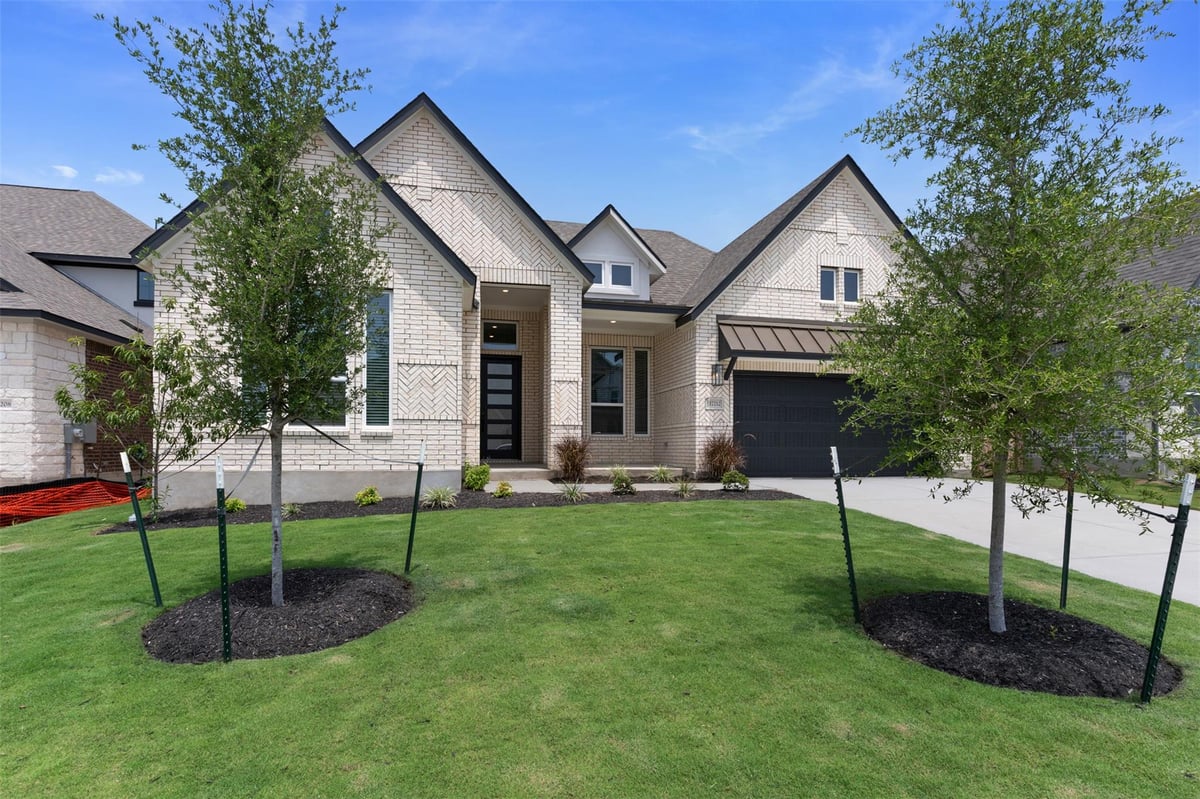 View 17212 Hope Bergman Rd in Grove at Blackhawk 17212 Hope Bergman Rd - front exterior - Luxury home in Grove at Blackhawk, Pflugerville, TX
