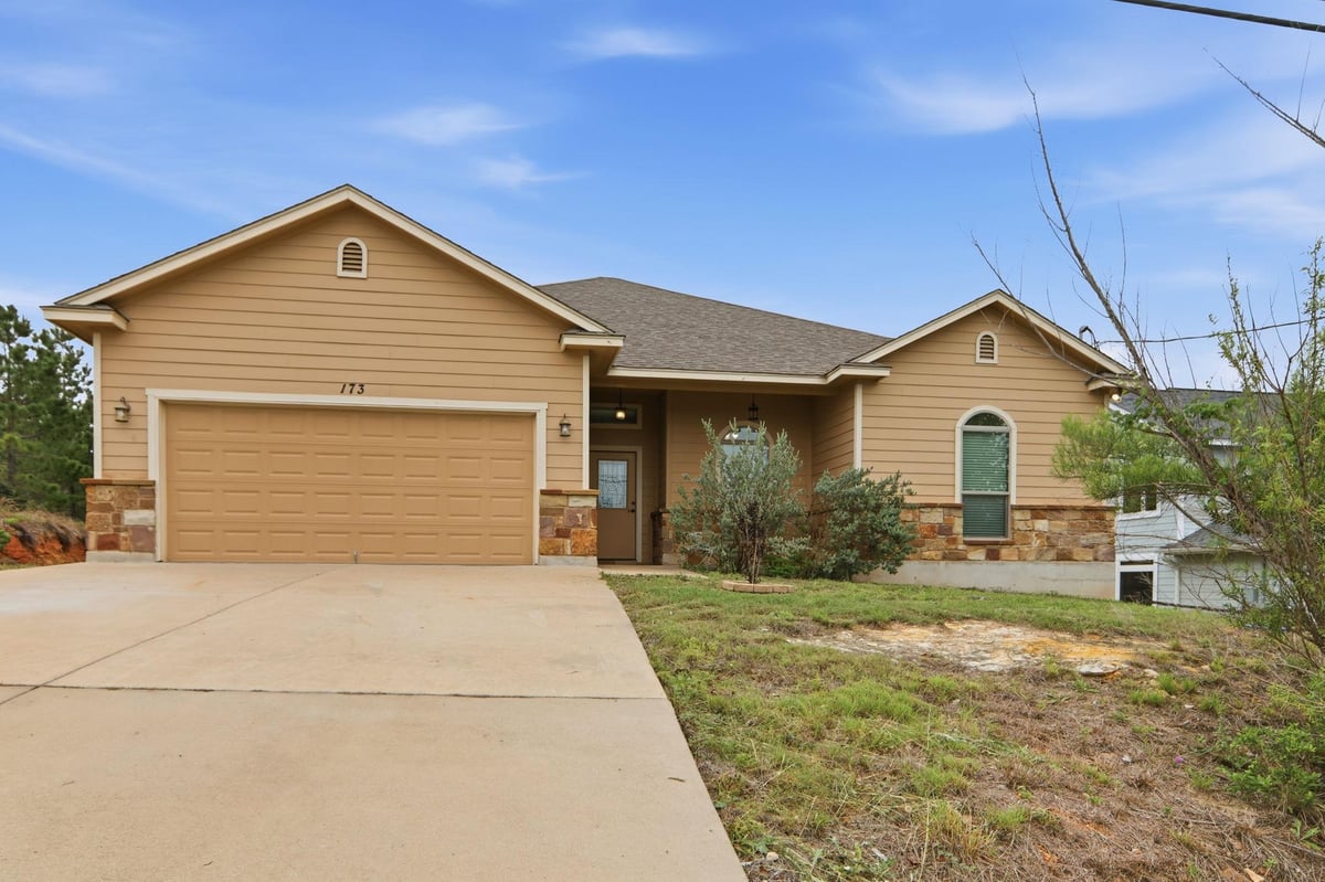 View 173 Kipahulu Dr in Tahitian Village, 173 Kipahulu Dr - front exterior - Luxury home in Tahitian Village,, Bastrop, TX