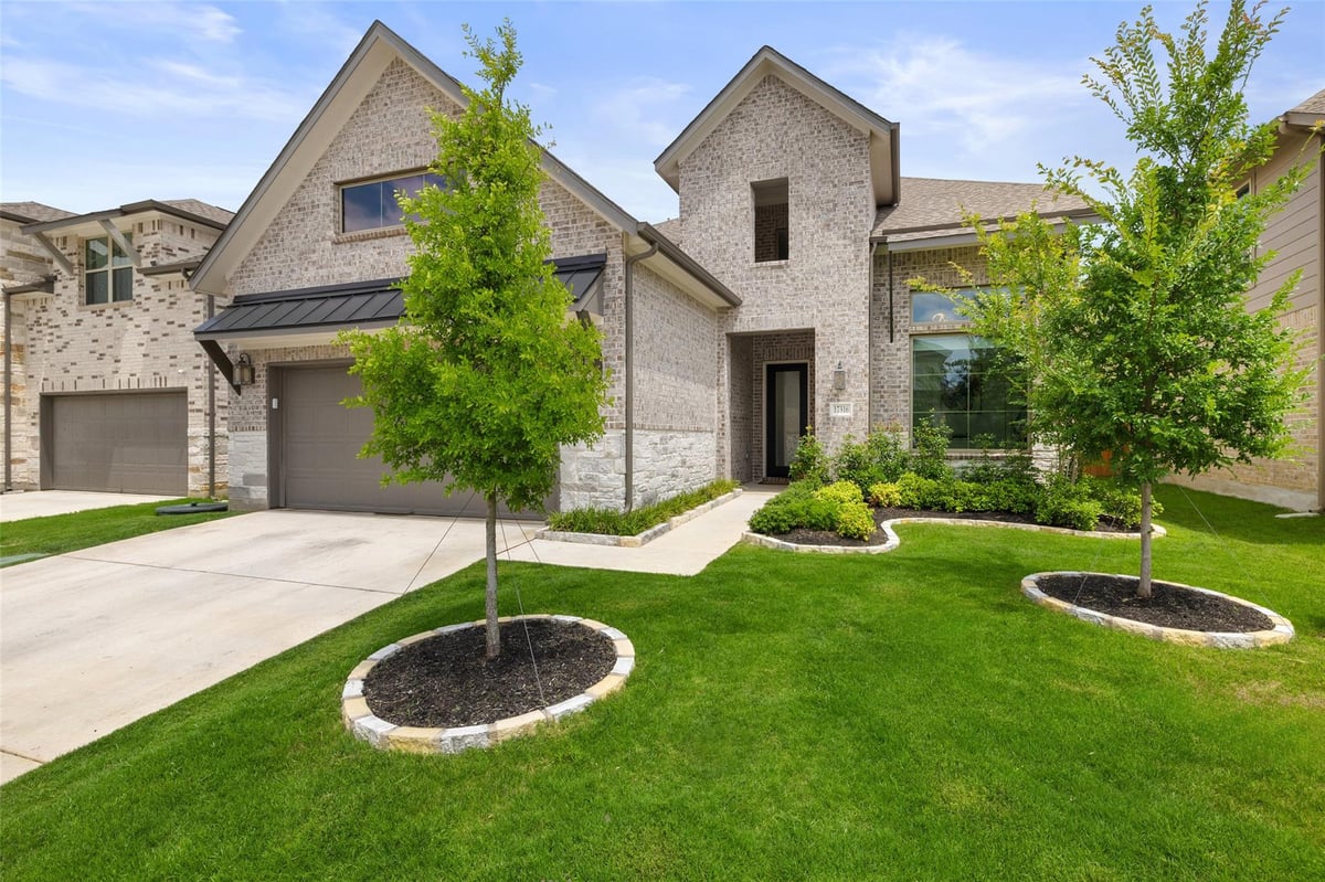 View 17316 Cain Clearing Pass in Sweetwater 17316 Cain Clearing Pass - front exterior - Luxury home in Sweetwater, Austin, TX