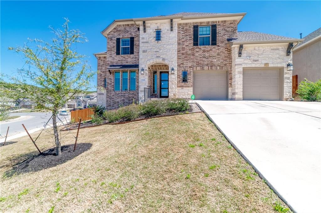 View 17724 SW Flowing Brook Dr in Sweetwater 17724 SW Flowing Brook Dr - front exterior - Luxury home in Sweetwater, Austin, TX