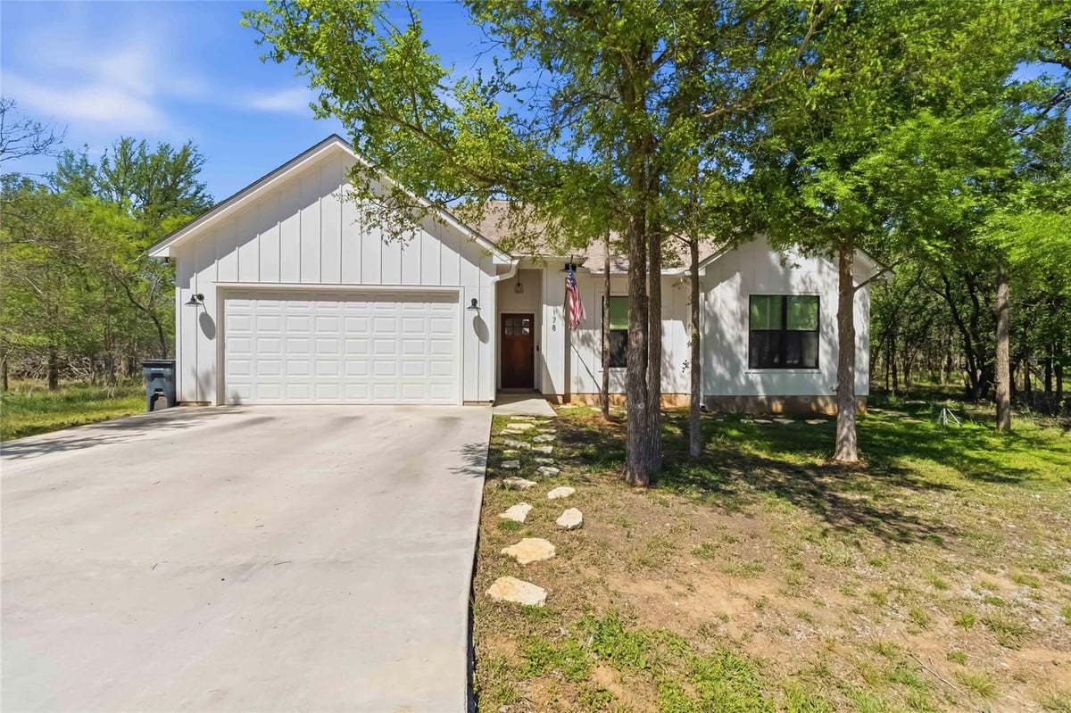 View 178 Waikakaaua Dr in Tahitian Village, 178 Waikakaaua Dr - front exterior - Luxury home in Tahitian Village,, Bastrop, TX
