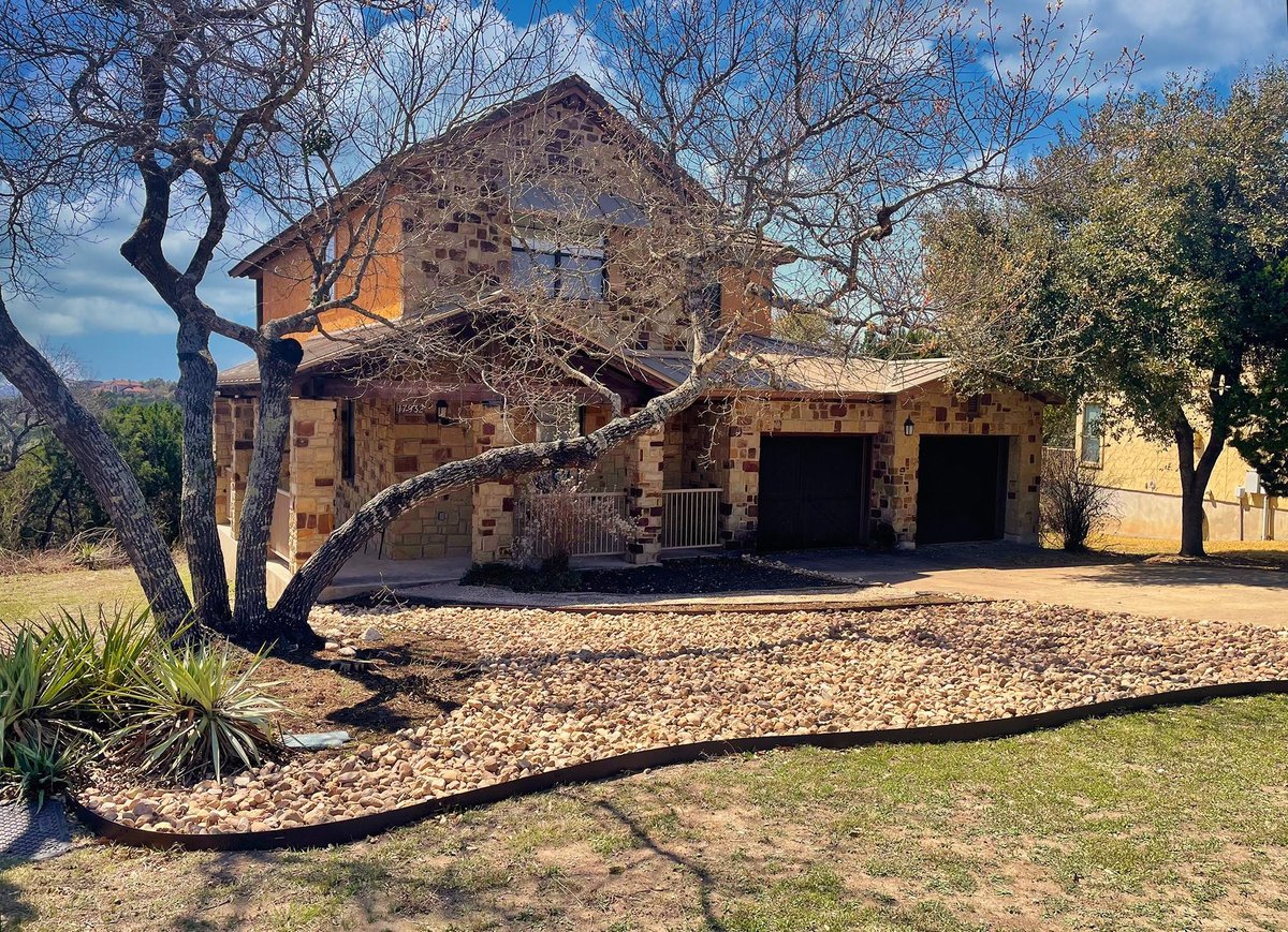 View 17932 Edgewood Way in The Hollows 17932 Edgewood Way - front exterior - Luxury home in The Hollows, Jonestown, TX