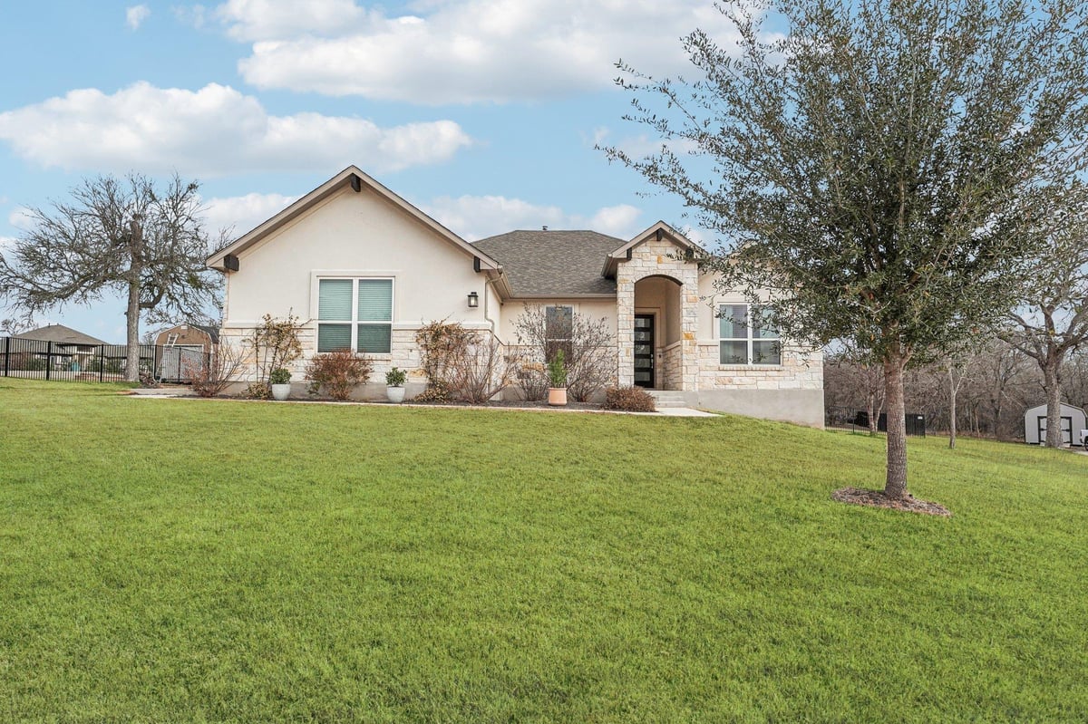 View 180 Pecos St in Double Eagle Ranch Sec 1 180 Pecos St - front exterior - Luxury home in Double Eagle Ranch Sec 1, Cedar Creek, TX